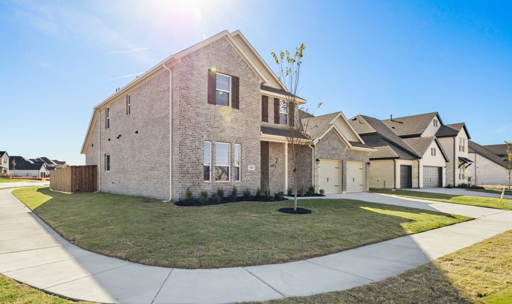 Front exterior of a new home in Lake Breeze, Lavon, TX, highlighting curb appeal (Image 22).
