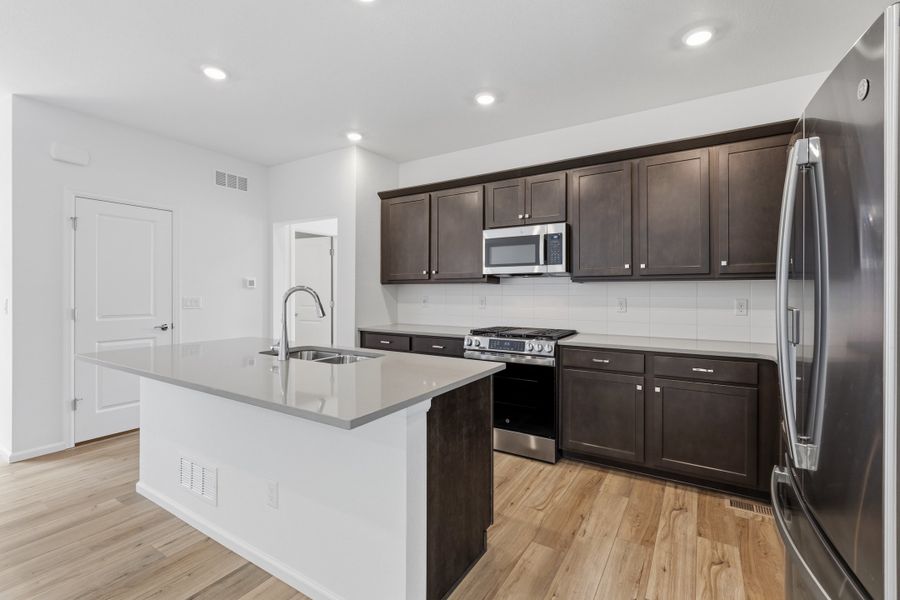 Furnished interior view inside a new home in Woodrose at Painted Prairie, Aurora (Image 5).