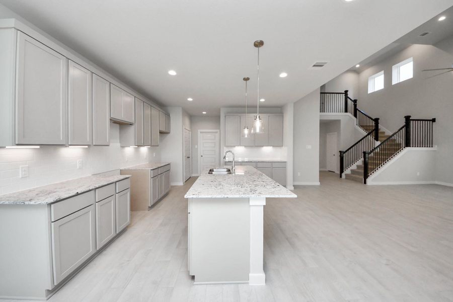 This generously spacious kitchen is a dream realized! Sample photo of completed home with similar floor plan. Actual colors and selections may vary. This generously spacious kitchen is a dream realized! Sample photo of completed home with similar floor plan. Actual colors and selections may vary.