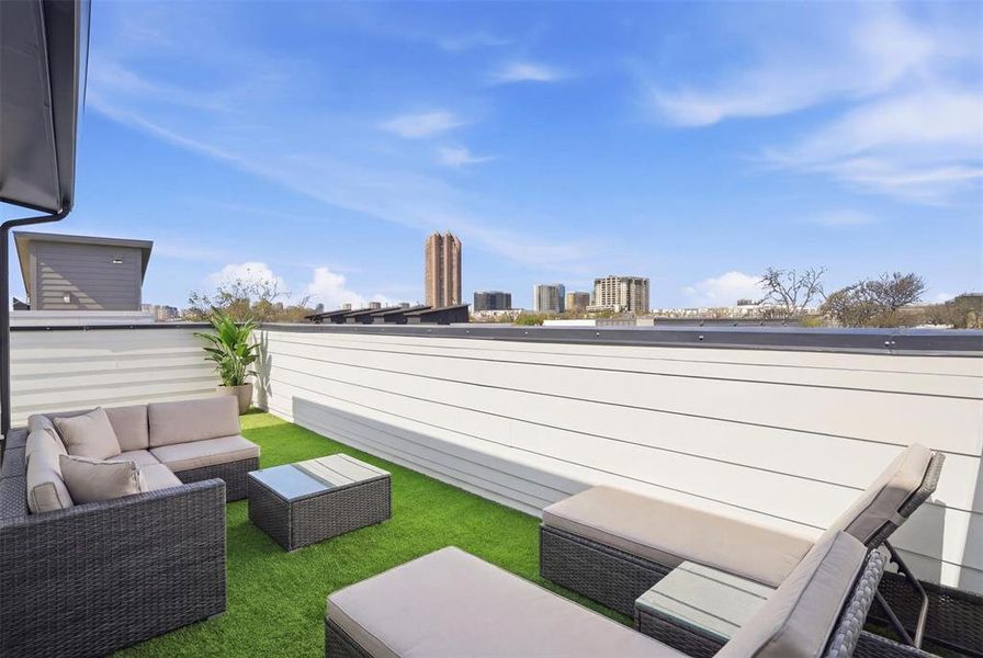 4th story rooftop with downtown views! BONUS: Turfed flooring!