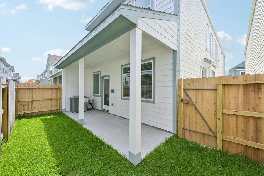 Exterior details and patio area of a home in Kemah Crossing - City Series, Kemah (Image 29).
