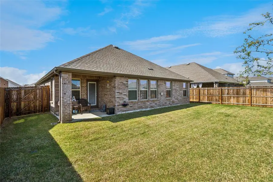 Exterior details and patio area of a home in , Providence Village (Image 4).