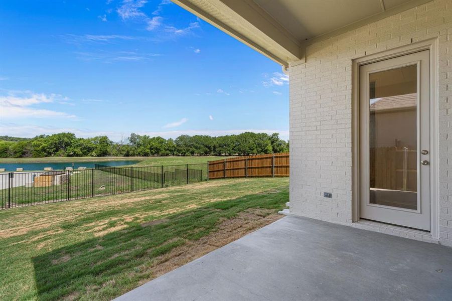 Exterior details and patio area of a home in The Bluffs at Parks of Aledo, Aledo (Image 3).