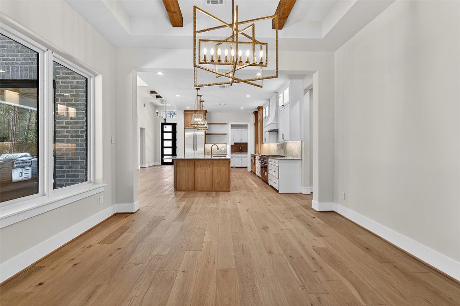 Seamless flow to the kitchen and living areas enhances connectivity.