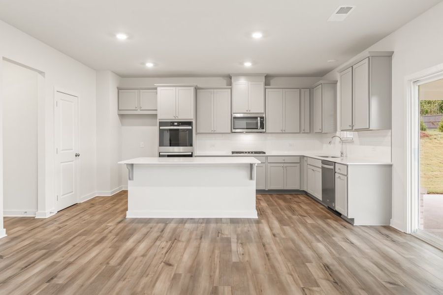 A kitchen with white cabinets. A kitchen with white cabinets.