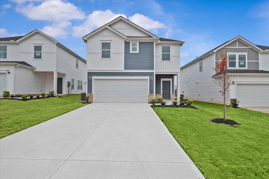 Front exterior of a new home in The Farm at Wells Creek - Heritage Collection, Gray Court, SC, highlighting curb appeal (Image 1).