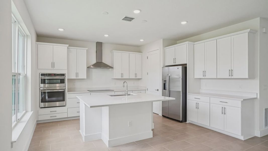 Plumeria Floor Plan featuring a bright kitchen with large island by DRB Homes in Trailside located in Mount Dora, FL Plumeria Floor Plan featuring a bright kitchen with large island by DRB Homes in Trailside located in Mount Dora, FL