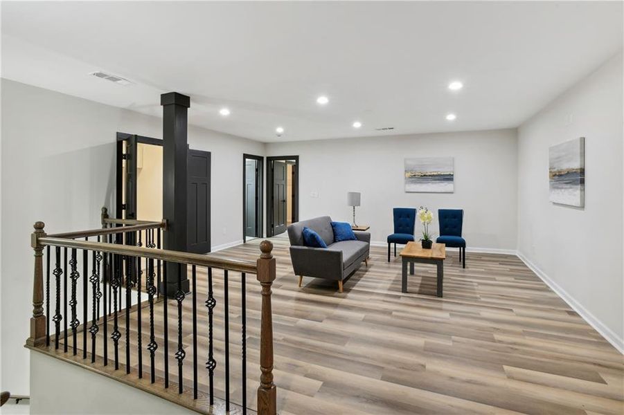 Living room featuring Luxury Vinyl Plank flooring