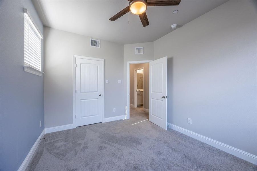 12' x 10' Secondary bedroom, with ceiling fan and window blinds - View