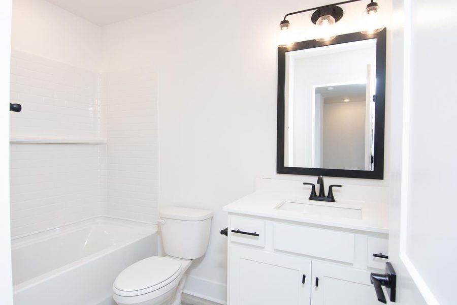 Representative furnished interior of a home built from the 1692 Townhome by Adams Homes in Parkstone Place Townhomes, Roebuck (Image 8).
