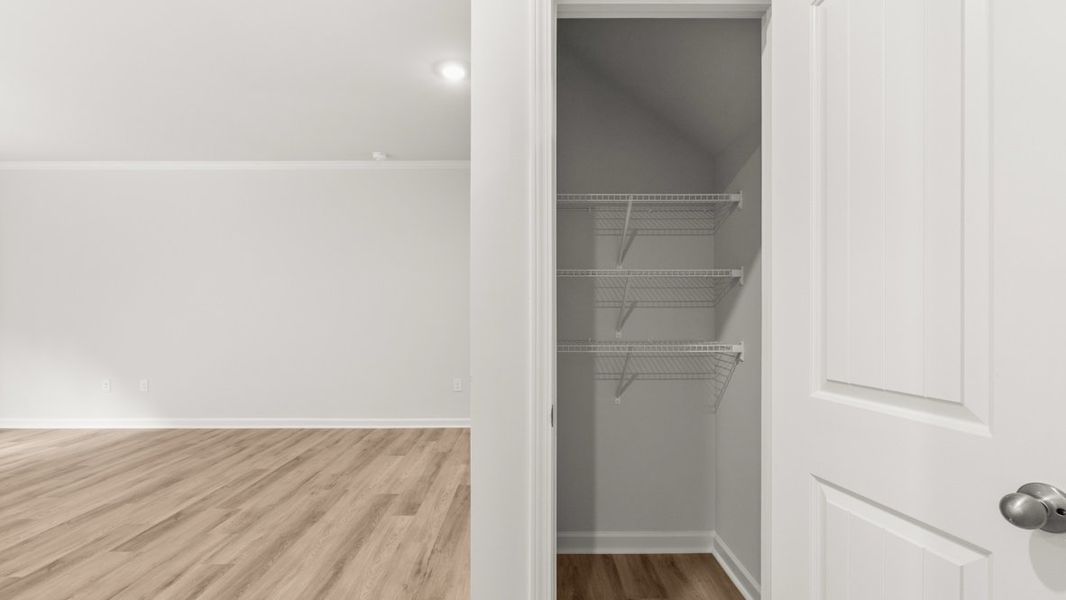 Representative unfurnished interior of a home built from the Salisbury by D.R. Horton in Waypoint, Flowery Branch (Image 13).
