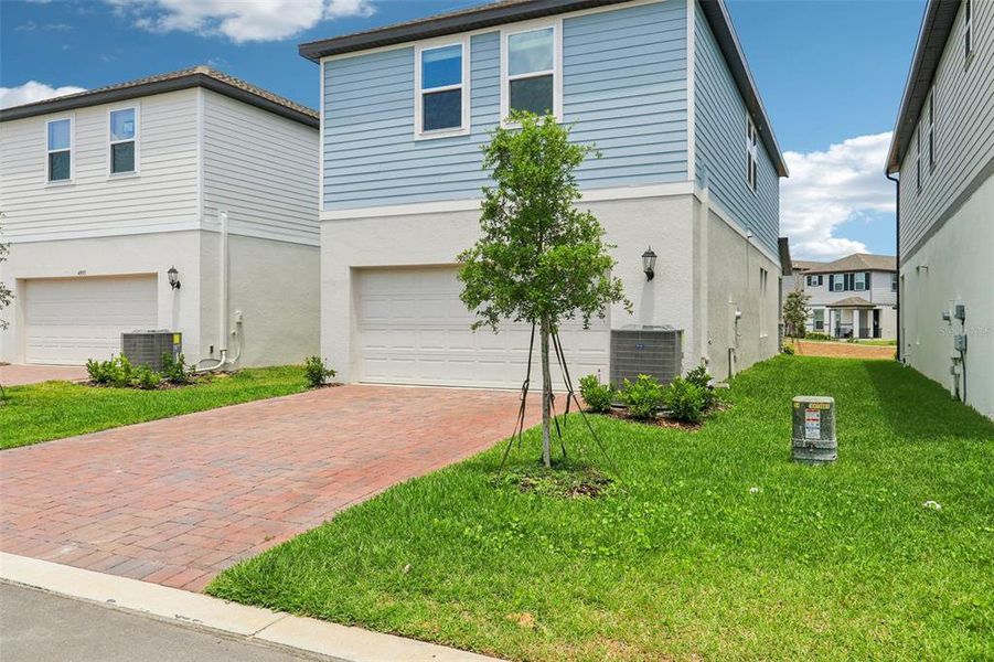 Front exterior of a new home in Silverleaf Reserve Bungalows, Winter Garden, FL, highlighting curb appeal (Image 17).