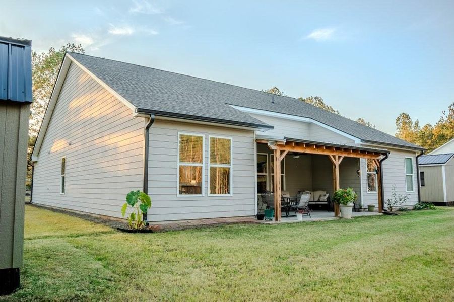 Exterior details and patio area of a home in Crossing Creeks, Monroe (Image 4).