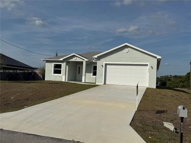 Front exterior of a new home in , Labelle, FL, highlighting curb appeal (Image 2).