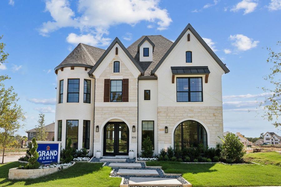 Representative exterior photo of a completed home built from the Royal Hampton II by Grand Homes in Edgewater, Fate, TX (Image 2).