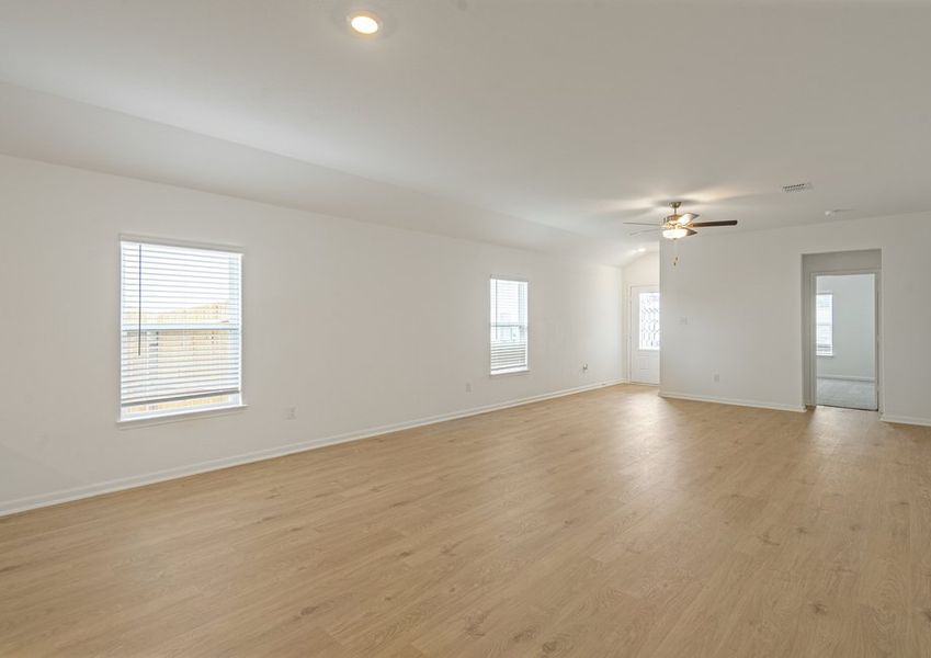 Open-concept family room and adjoining kitchen