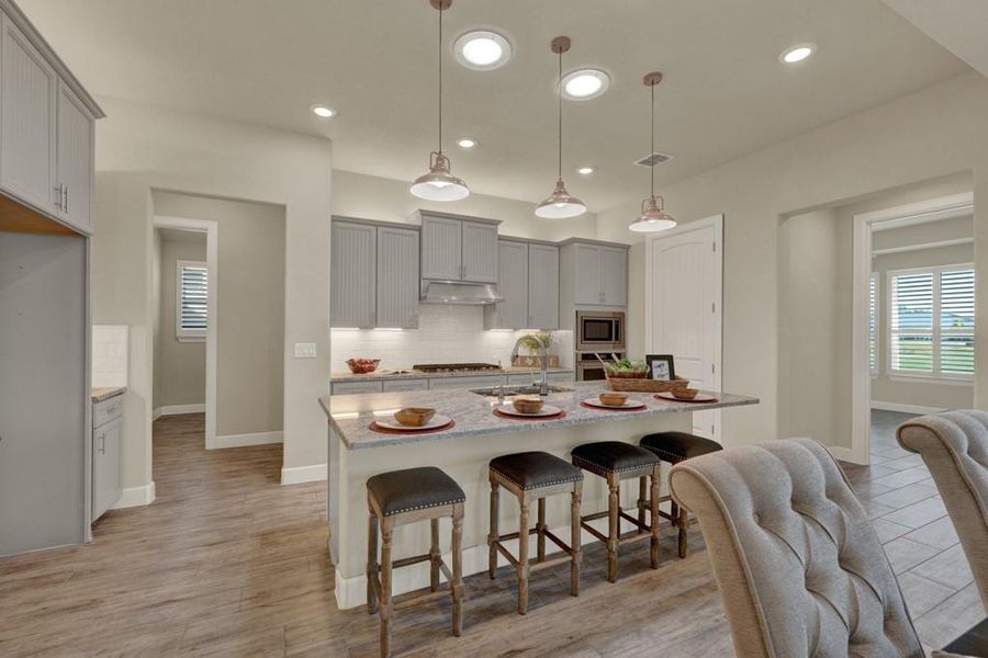 Chef's kitchen w/ custom light gray cabinetry