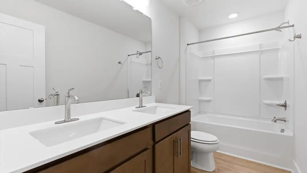 Well-appointed full bath with high standards of craftsmanship and everyday function at the Pelham Crossing community