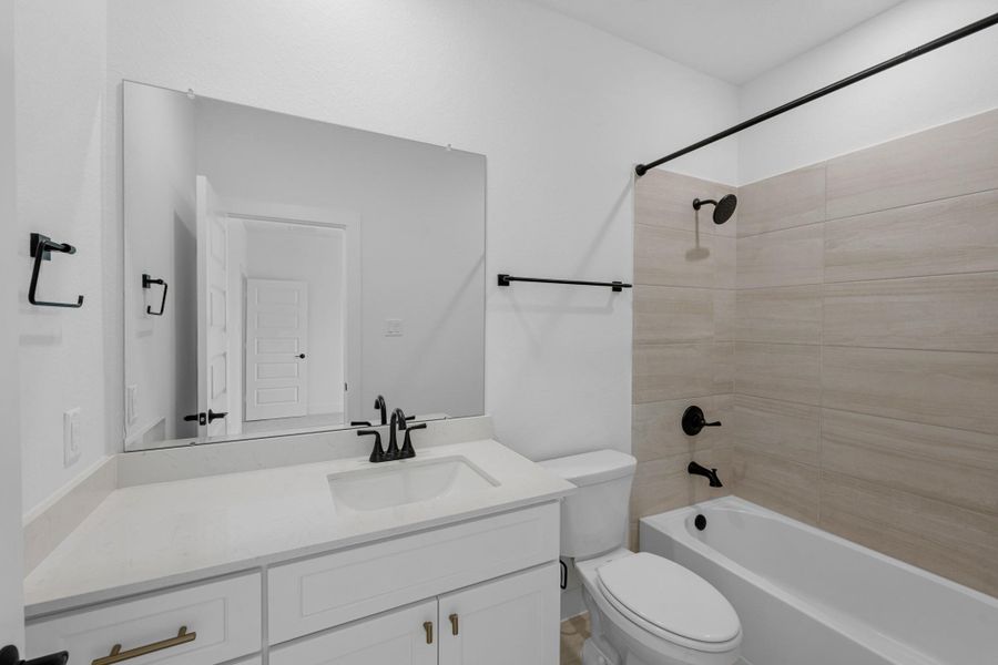 Furnished interior view inside a new home in Bridgeland, Cypress (Image 30).