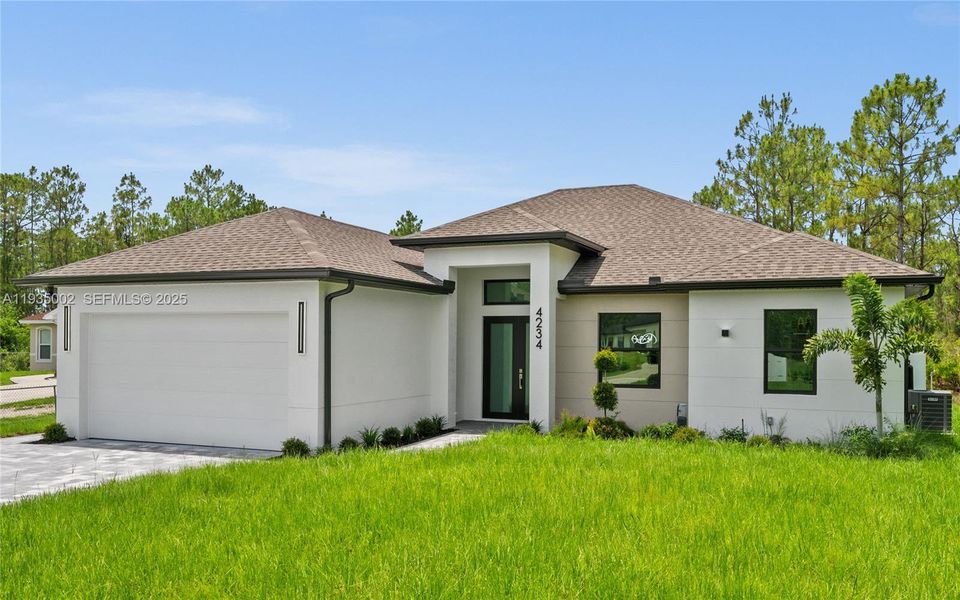 Front exterior of a new home in , Naples, FL, highlighting curb appeal (Image 2). Front exterior of a new home in , Naples, FL, highlighting curb appeal (Image 2).