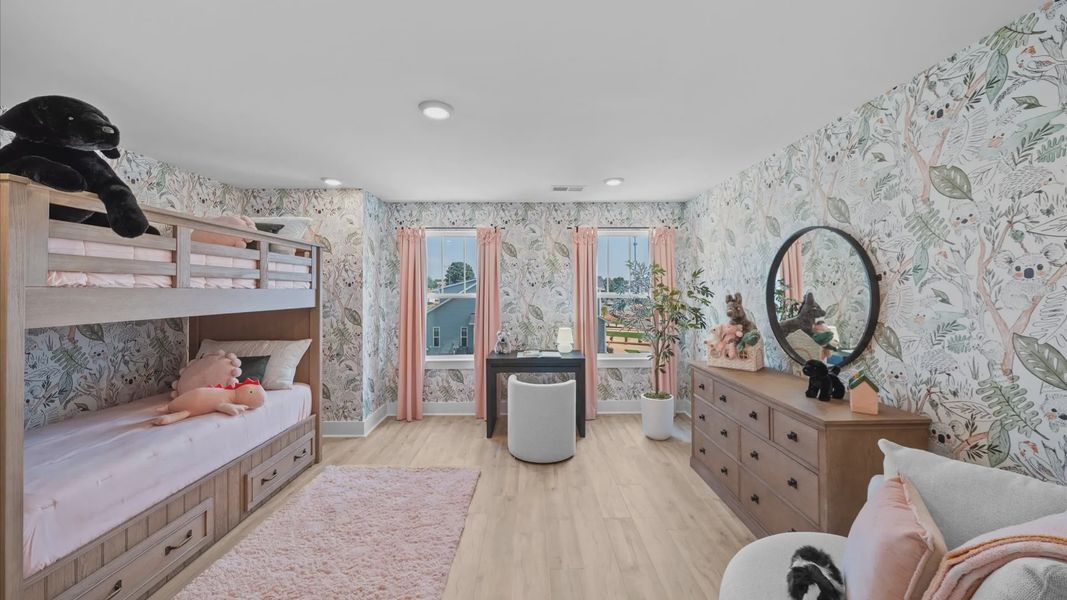 Thoughtfully designed secondary bedroom featuring hardwood flooring and tasteful detail at Barton Hollow