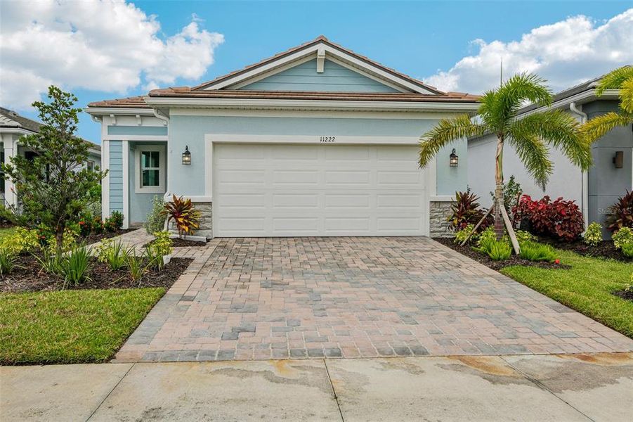 Front exterior of a new home in , Venice, FL, highlighting curb appeal (Image 1).