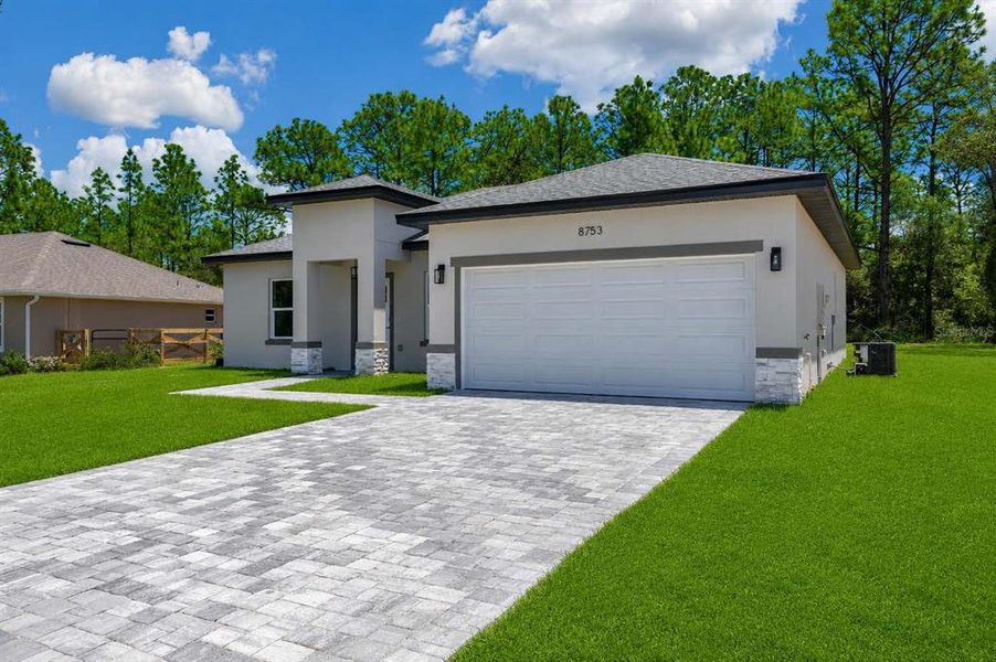 Front exterior of a new home in , Citrus Springs, FL, highlighting curb appeal (Image 22). Front exterior of a new home in , Citrus Springs, FL, highlighting curb appeal (Image 22).
