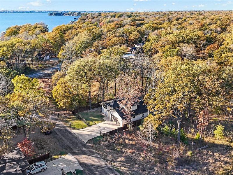 View of subject property featuring a heavily wooded area