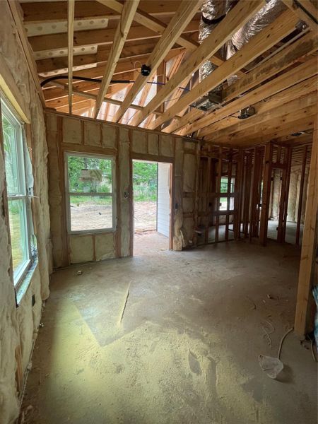 Dining room open to the functional kitchen with access to the backyard.