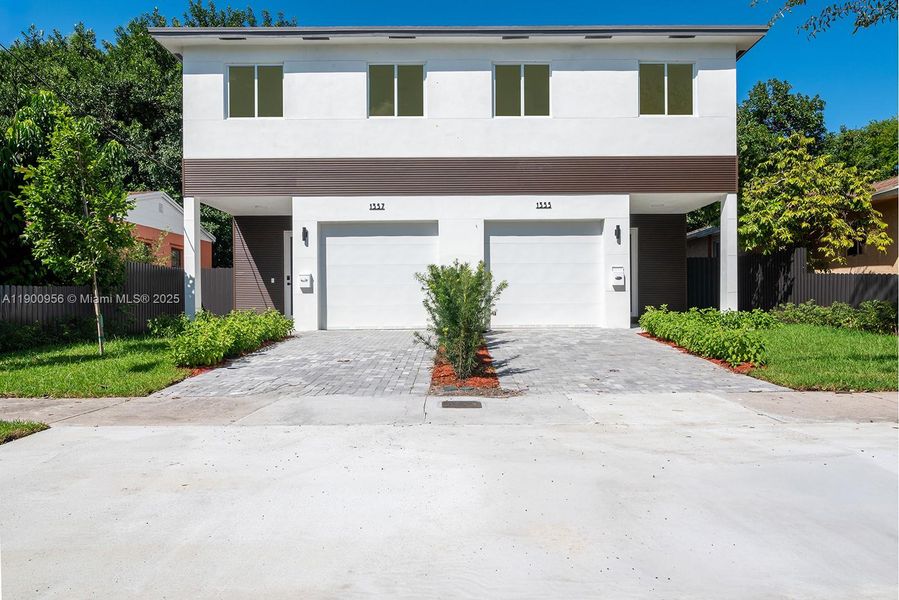 Front exterior of a new home in , Miami, FL, highlighting curb appeal (Image 1). Front exterior of a new home in , Miami, FL, highlighting curb appeal (Image 1).
