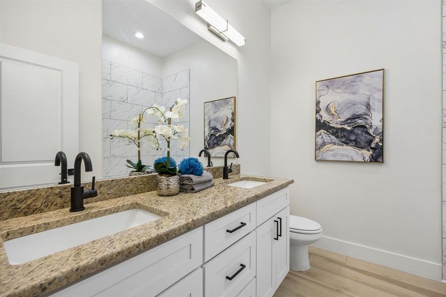 Full bathroom at the front of the house is between the secondary bedrooms.
