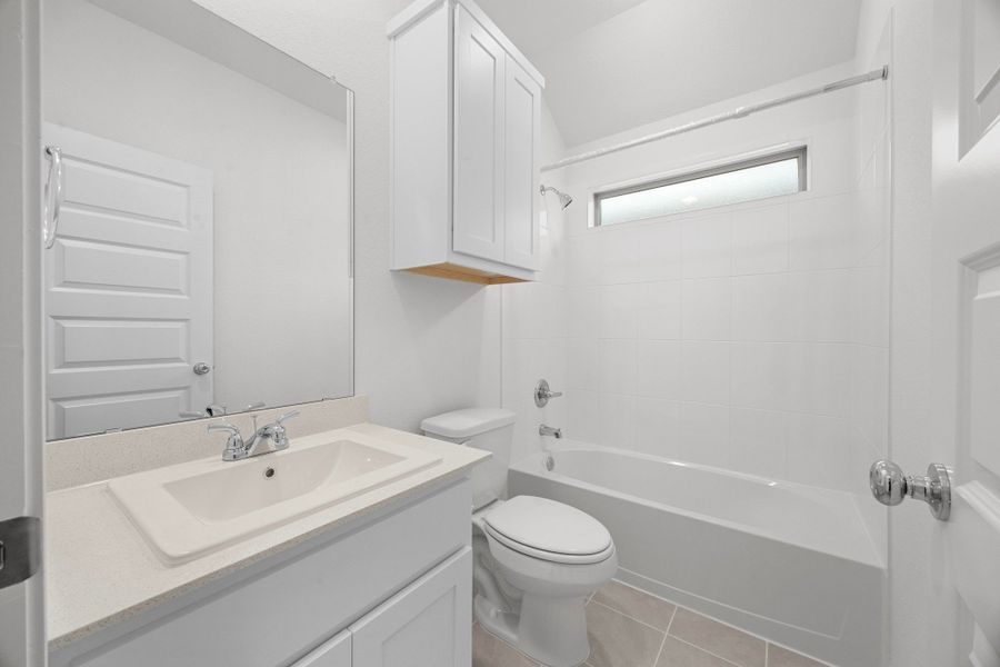 Bathroom in the Cypress home plan by Trophy Signature Homes - REPRESENTATIVE PHOTO