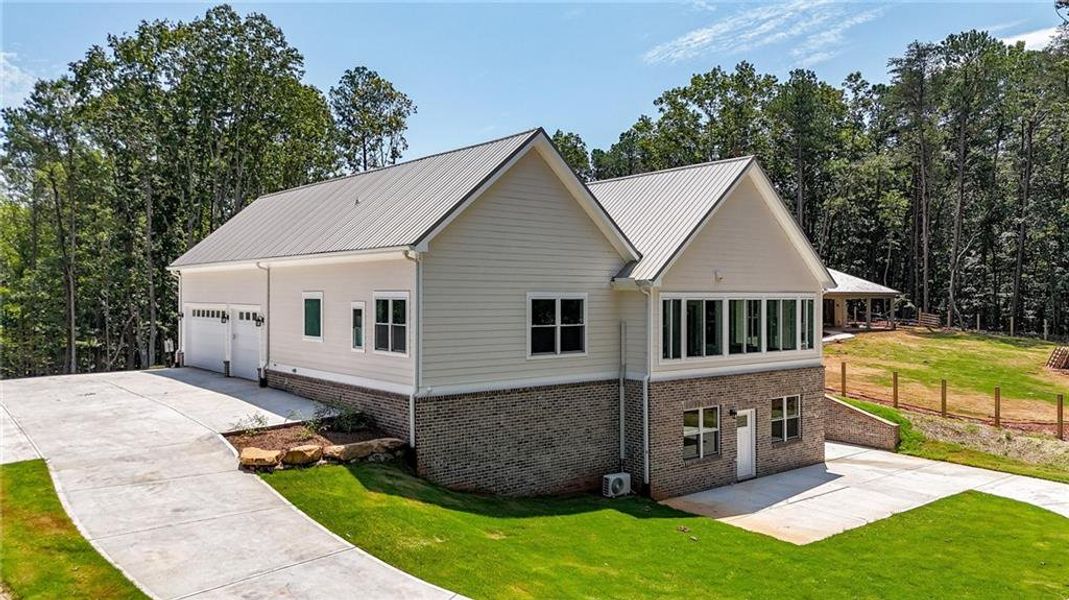 Front exterior of a new home in , Canton, GA, highlighting curb appeal (Image 29).