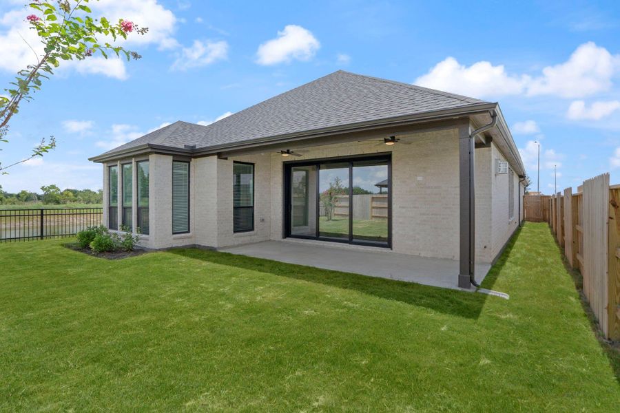 Front exterior of a new home in Valencia, Manvel, TX, highlighting curb appeal (Image 2).