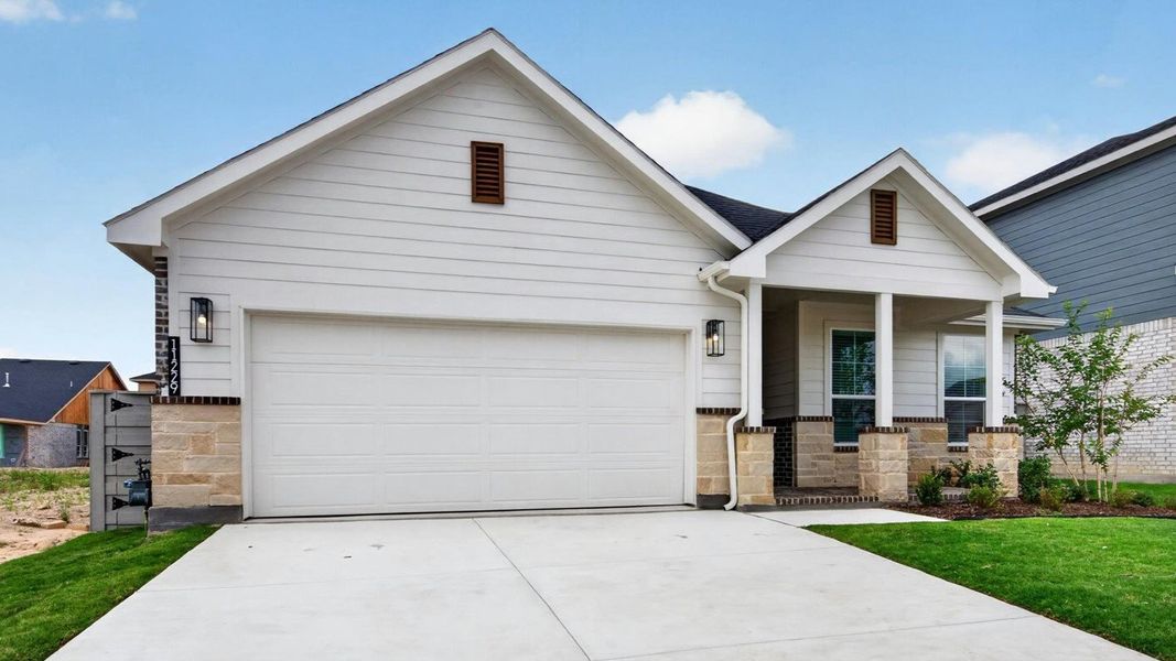 Representative exterior photo of a completed home built from the Basswood by D.R. Horton in Treeline, Justin, TX (Image 2). Representative exterior photo of a completed home built from the Basswood by D.R. Horton in Treeline, Justin, TX (Image 2).