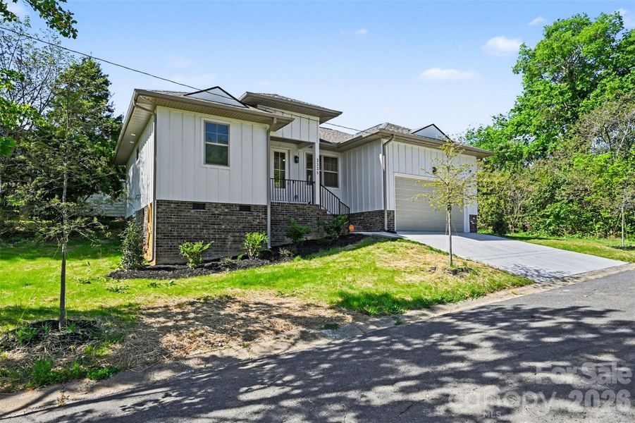 Front exterior of a new home in , Charlotte, NC, highlighting curb appeal (Image 19).