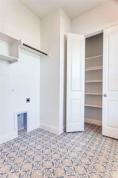 Laundry area with baseboards and hookup for an electric dryer Laundry area with baseboards and hookup for an electric dryer