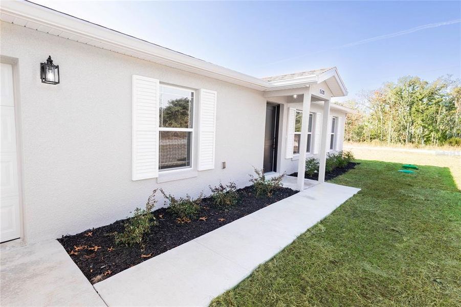 Exterior details and patio area of a home in , Williston (Image 17).