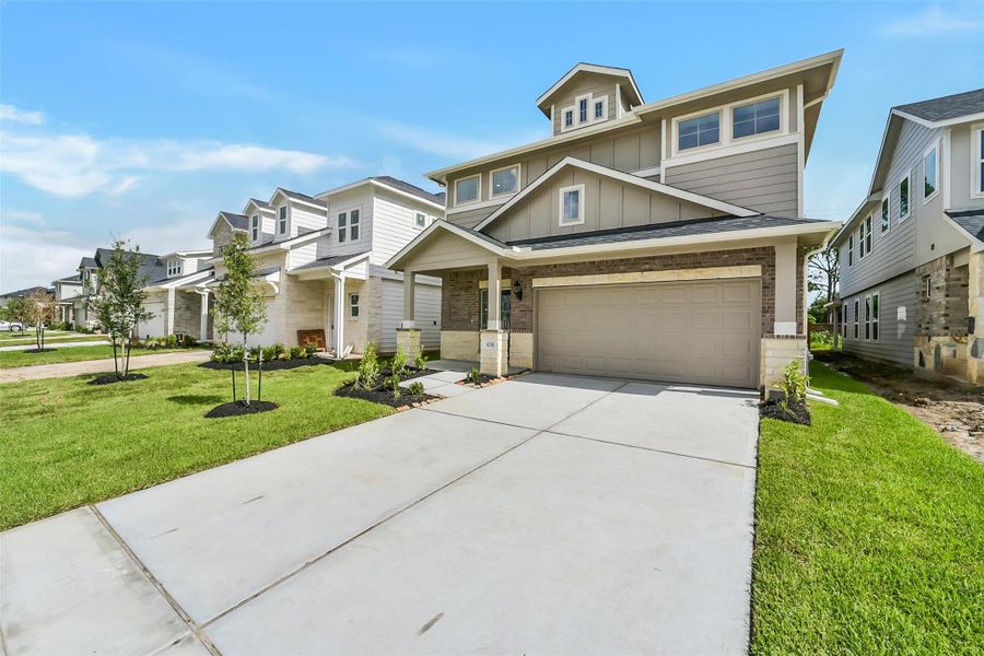 Front exterior of a new home in Anderson Lake, Houston, TX, highlighting curb appeal (Image 23). Front exterior of a new home in Anderson Lake, Houston, TX, highlighting curb appeal (Image 23).