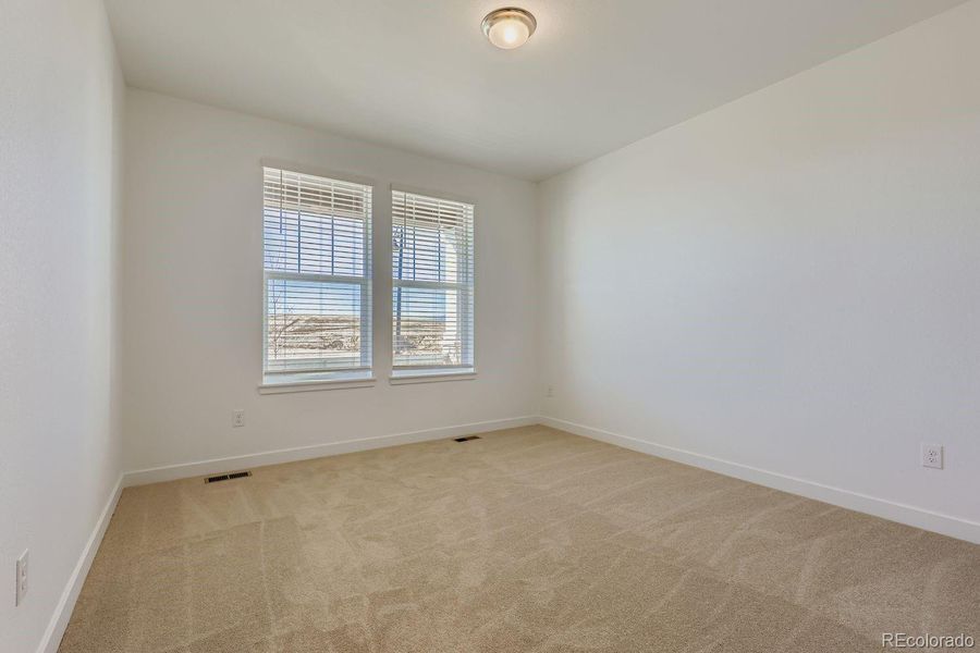 Spacious, unfurnished interior of a new home in Sunset Village: The Grand Collection, Erie (Image 8).