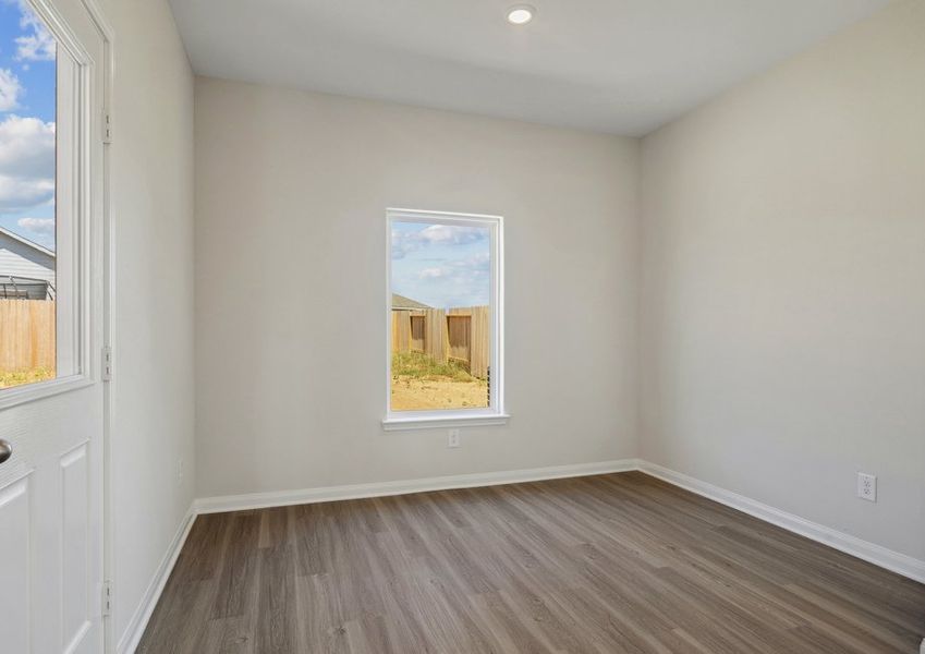 Dining room with a door that leads to the backyard Dining room with a door that leads to the backyard
