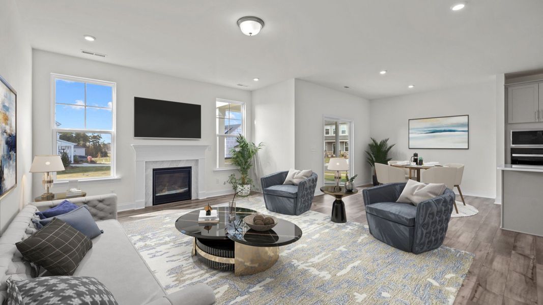 Open concept family room and breakfast area in the Fairfield Design by DRB Homes in Mooresville, NC Open concept family room and breakfast area in the Fairfield Design by DRB Homes in Mooresville, NC