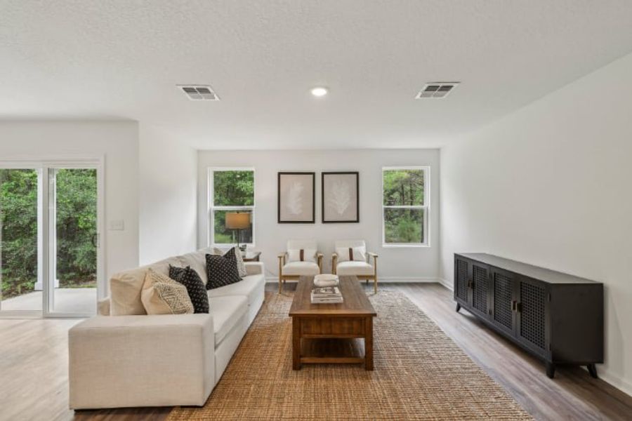 A living room with a tv and couches.