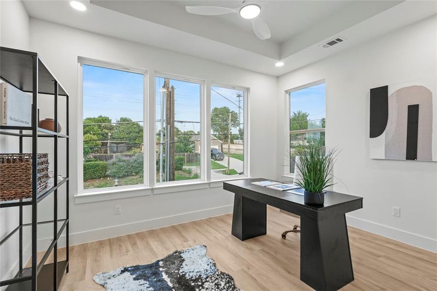 Office featuring plenty of natural light, ceiling fan, baseboards, wood finished floors, and recessed lighting Office featuring plenty of natural light, ceiling fan, baseboards, wood finished floors, and recessed lighting