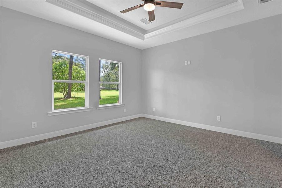 Primary bedroom with golf course view.