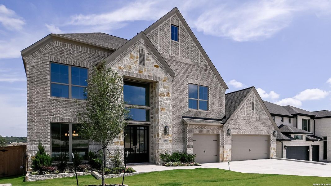 Front exterior of a new home in Johnson Ranch, Bulverde, TX, highlighting curb appeal (Image 22). Front exterior of a new home in Johnson Ranch, Bulverde, TX, highlighting curb appeal (Image 22).