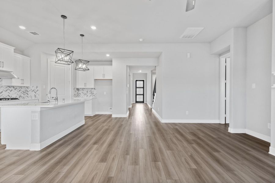 View of hallway and entry from the living room. View of hallway and entry from the living room.