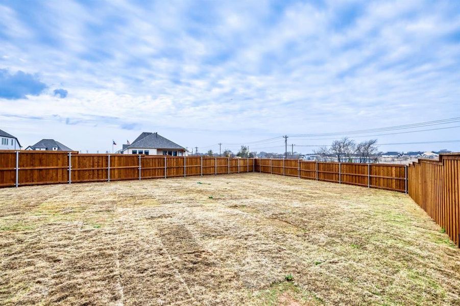 View of fenced backyard