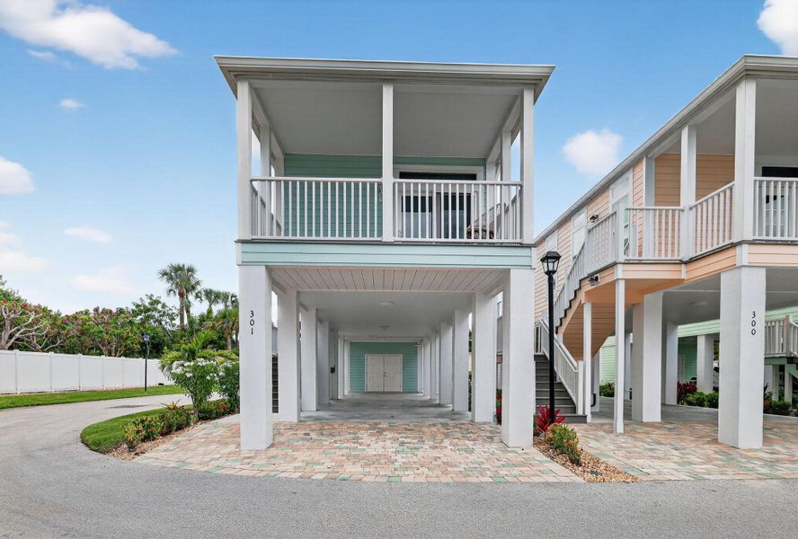 Front exterior of a new home in , Jensen Beach, FL, highlighting curb appeal (Image 20).