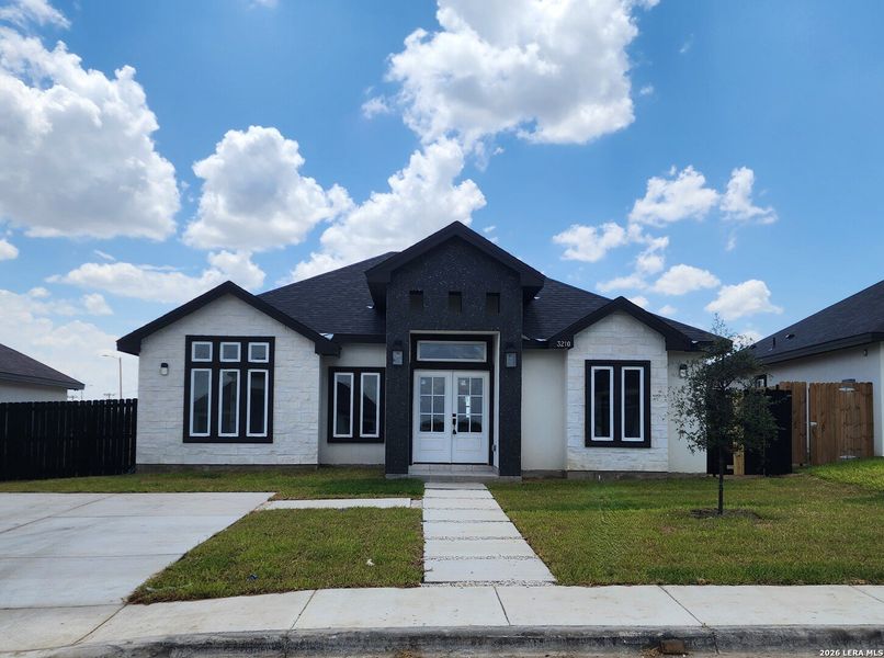 Front exterior of a new home in , Eagle Pass, TX, highlighting curb appeal (Image 22). Front exterior of a new home in , Eagle Pass, TX, highlighting curb appeal (Image 22).